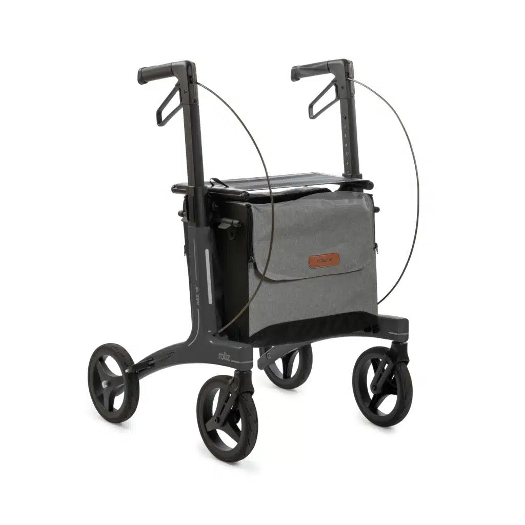 Rollz Air carbon rollator in coal black with its bags, three-quarter view