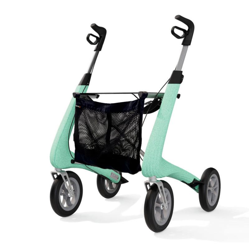 Mint green byACRE carbon rollator with the mesh bag fitted, angled view