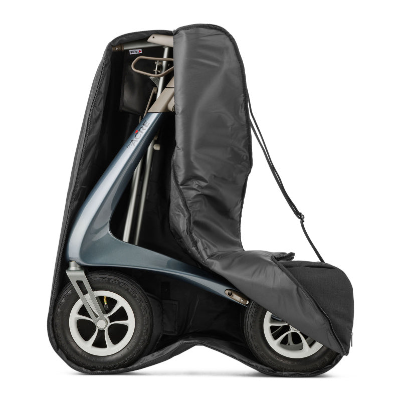 Black byACRE travel cover over a folded Carbon Overland rollator, wheels exposed